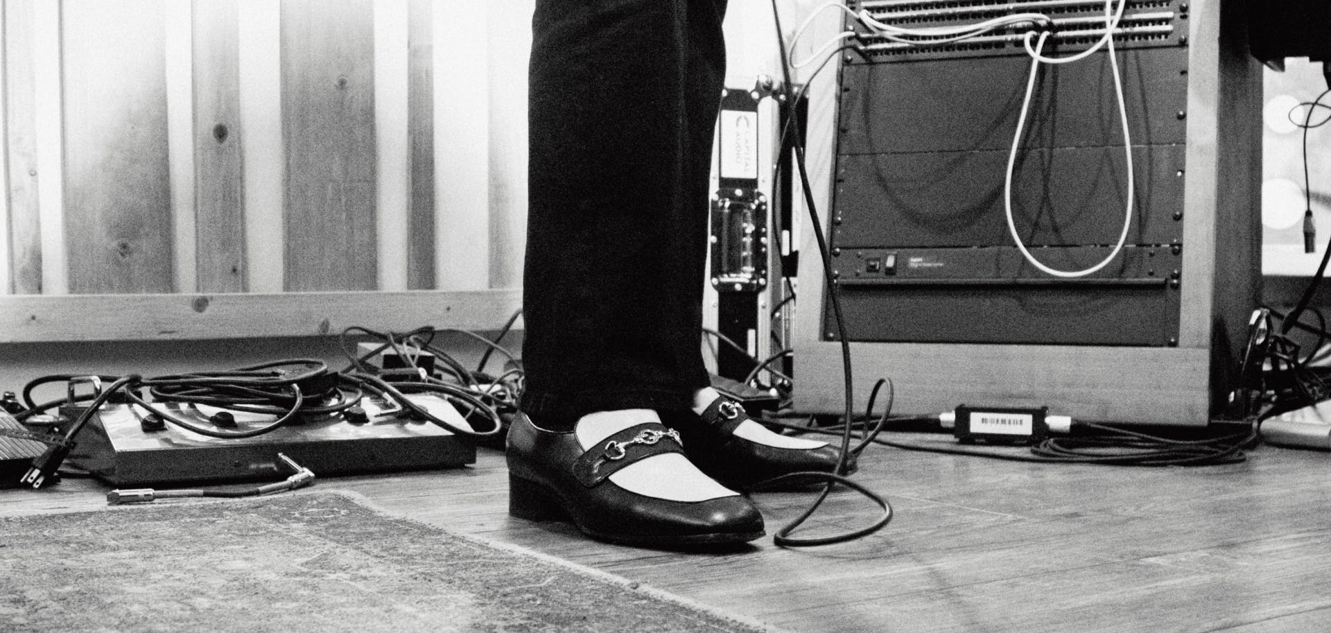 Picture of dress shoes among wires in the studio